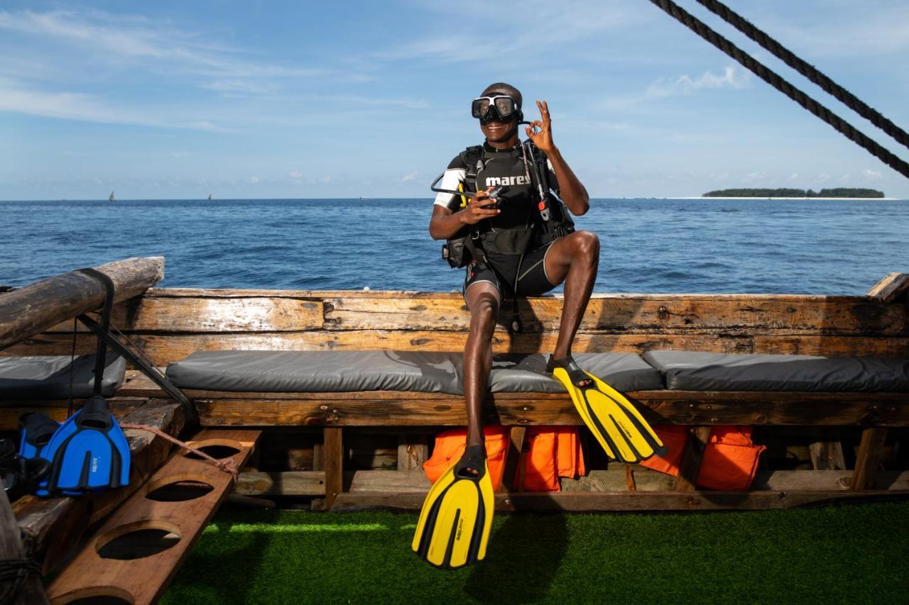 The Mora Zanzibar Hotel Matemwe  Ngoại thất bức ảnh Scuba diver with a pair of open heel fins